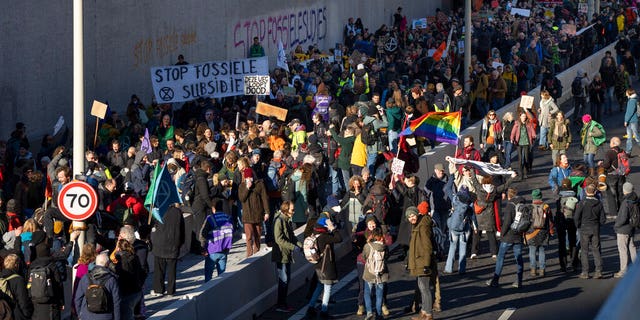 Extinction Rebellion activists and sympathisers block a busy road in The Hague, Netherlands, Saturday, Jan. 28, 2023. Earlier this week seven Extinction Rebellion activists were detained by authorities for sedition linked to the protest. 