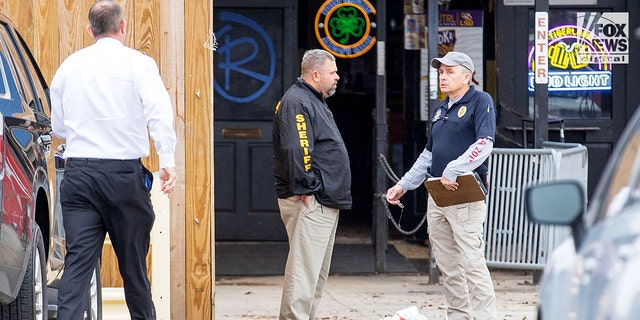 Investigators are seen outside of  Reggie’s bar in Baton Rouge, Louisiana on Tuesday, January 24, 2023. The bar is reportedly one of the last places where LSU student, Madison Morgan was seen before her death on January 15.