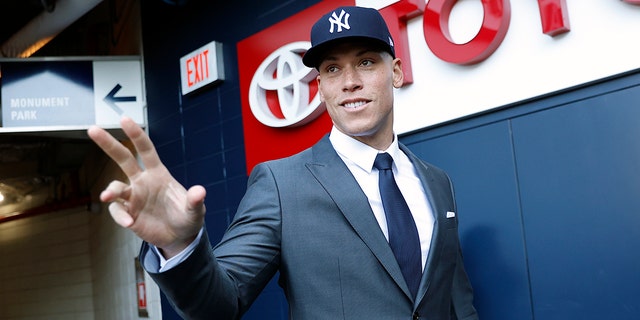 Aaron Judge, #99 of the New York Yankees, waves to fans after a press conference at Yankee Stadium on Dec. 21, 2022 in the Bronx, New York.