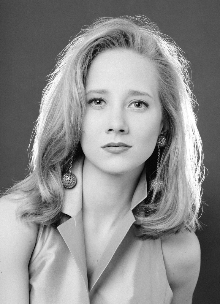 Anne Heche in 1991 smiling. 