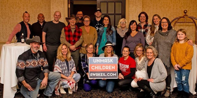 Members of education activism group Awake Illinois pose at event. Photo provided by Shannon Adcock, president and founder of Awake Illinois.