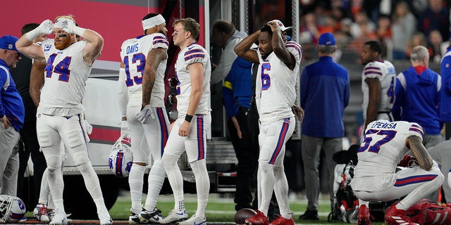 Buffalo Bills players react as teammate Damar Hamlin is attended by medical staff, Monday, Jan. 2, 2023, in Cincinnati.
