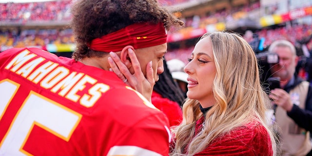 Kansas City Chiefs quarterback Patrick Mahomes, #15, kisses Brittany Matthews before the AFC Championship Game against the Cincinnati Bengals at GEHA Field at Arrowhead Stadium Jan. 30, 2022 in Kansas City, Missouri.