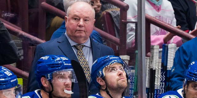 Canucks head coach Bruce Boudreau on the bench against Carolina Hurricanes at Rogers Arena in Vancouver on Oct. 24, 2022.