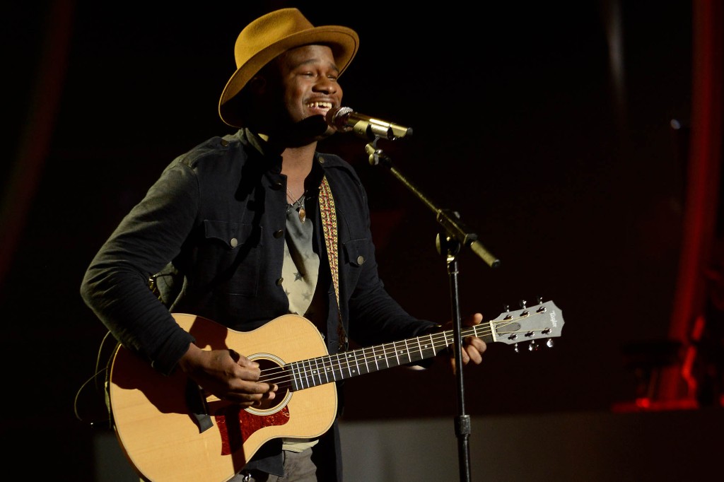 Contestant CJ Harris performs onstage at FOX's "American Idol XIII" Top 11 Live Performance Show on March 12, 2014 in Hollywood, California.