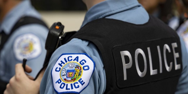 Chicago police officers in the West Englewood neighborhood of Chicago on Aug. 11, 2022. 