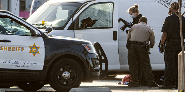 Tran was found dead in a van Sunday in Torrance of a self-inflicted gunshot wound. Here, a body is seen on the driver's side of the van as authorities investigate.