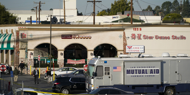 Investigators are seen outside the Star Dance Studio in Monterey Park, California, on Sunday, Jan. 22.