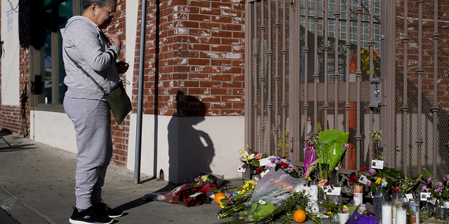 Yolanda Gallegos, 72, prays for victims killed in a shooting outside Star Dance Studio in Monterey Park, California, on Monday, Jan. 23.