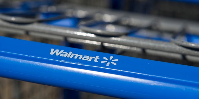 The Walmart Stores Inc. logo is displayed on a shopping cart standing in front of a location in American Canyon, California, Feb. 16, 2012. 