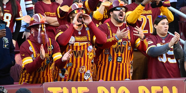 Jan 1, 2023; Landover, Maryland, USA; Washington Commanders fans cheer against the Cleveland Browns during the first half at FedExField. 