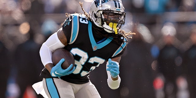 D'Onta Foreman of the Panthers runs against the Detroit Lions at Bank of America Stadium on Dec. 24, 2022, in Charlotte, North Carolina.