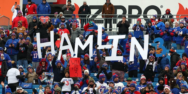 Buffalo Bills fans hold signs in support of Buffalo Bills safety Damar Hamlin before the New England Patriots game at Highmark Stadium on Jan. 8, 2023, in Orchard Park, New York.