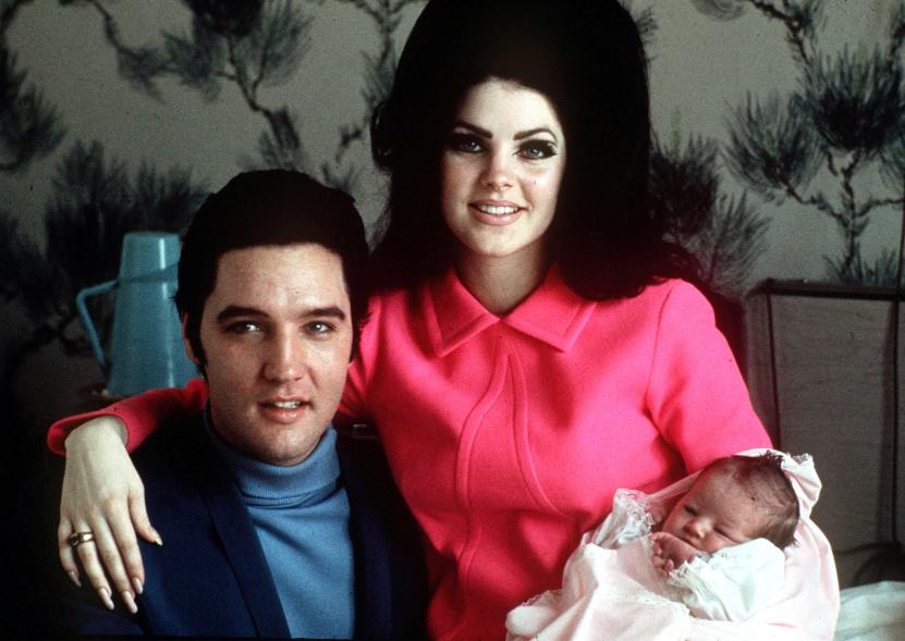 Elvis Presley poses with wife Priscilla and their daughter Lisa Marie in a room at Baptist hospital in Memphis, Tenn., on Feb. 5, 1968.