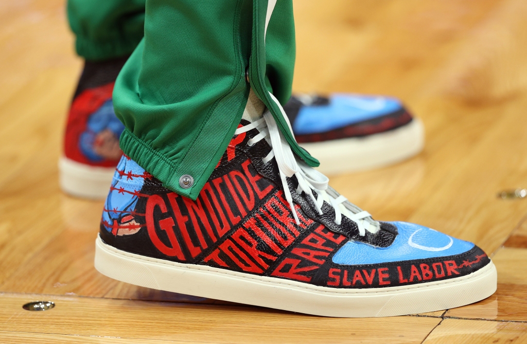 Freedom was known in the NBA for wearing sneakers with protest messages painted by dissident artists.