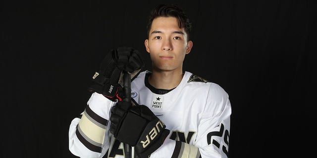 Army hockey player Eric Huss poses for a picture