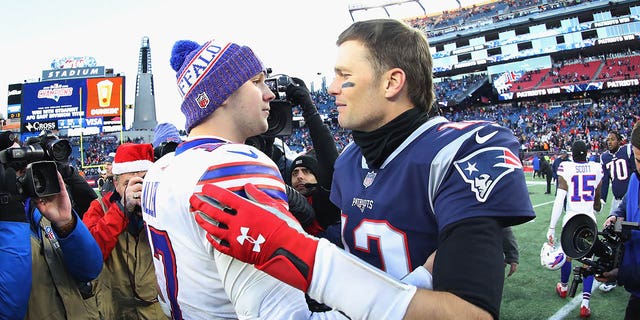 Josh Allen #17 of the Buffalo Bills and Tom Brady #12 of the New England Patriots meet on the field after the New England Patriots defeated the Buffalo Bills 24-12 at Gillette Stadium on December 23, 2018 in Foxborough, Massachusetts. 