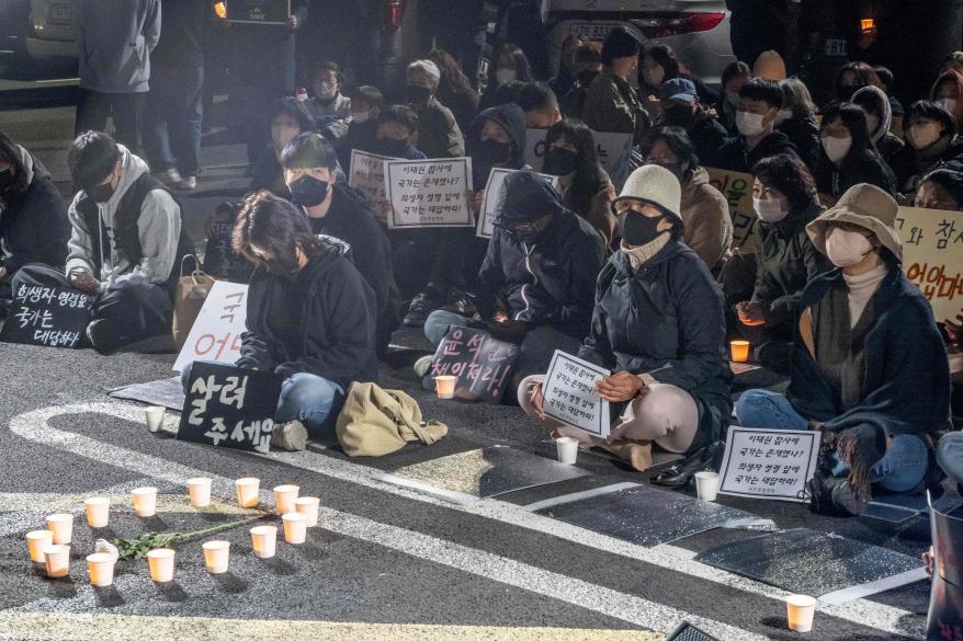 Mourners take part in a candlelight vigil to commemorate the 156 people killed in the Oct. 29 Halloween crowd crush in the resort island of Jeju on Nov. 5, 2022.