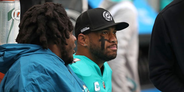 Dolphins quarterback Tua Tagovailoa sits on the bench against the Packers at Hard Rock Stadium on Dec. 25, 2022, in Miami Gardens.