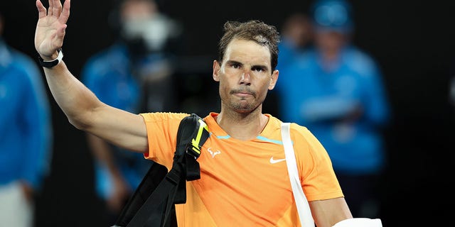 Rafael Nadal waves after his match against Mackenzie McDonald at the Australian Open in Melbourne on Jan. 18, 2023.