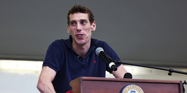 Joseph Borgen, a recent victim of a hate crime, speaks during a rally denouncing anti-Semitic violence on May 27, 2021 in Cedarhurst, New York. 