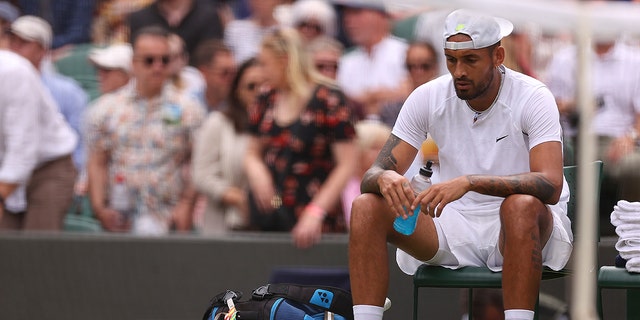 Nick Kyrgios of Australia reacts against Cristian Garin of Chile during their men's singles quarterfinal match at Wimbledon July 6, 2022, in London. 