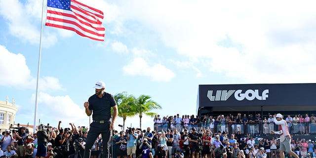 Dustin Johnson celebrates making his putt to win during the team championship round of the LIV Golf Invitational - Miami on Oct. 30, 2022, in Doral, Florida.