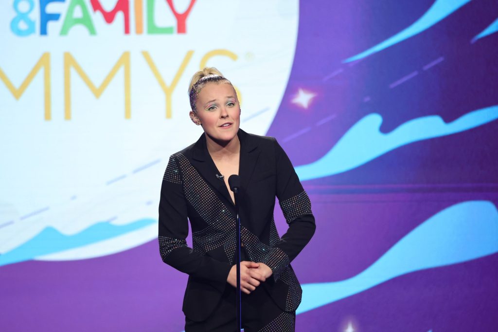 Host JoJo Siwa speaks onstage during the 2022 Children's & Family Creative Arts Emmys at Wilshire Ebell Theatre on Dec. 10, 2022, in Los Angeles. 