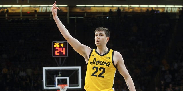 Forward Patrick McCaffery, #22 of the Iowa Hawkeyes, celebrates a basket during the first half against the Wisconsin Badgers at Carver-Hawkeye Arena, on Dec. 11, 2022 in Iowa City, Iowa.