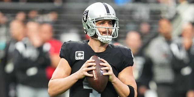 Las Vegas Raiders quarterback Derek Carr, #4, looks to throw during the first half of a game against the New England Patriots at Allegiant Stadium on Dec. 18, 2022 in Las Vegas.