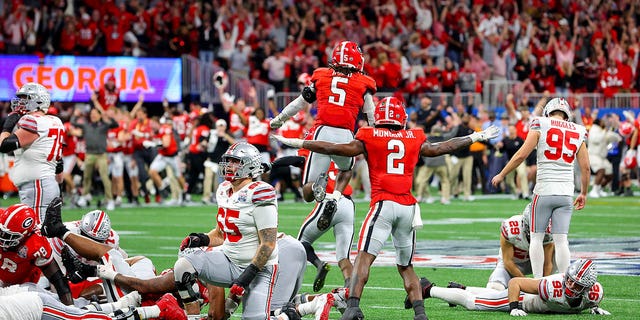 Noah Ruggles #95 of the Ohio State Buckeyes reacts after missing a field goal in the final seconds of the game against the Georgia Bulldogs in the Chick-fil-A Peach Bowl at Mercedes-Benz Stadium on December 31, 2022 in Atlanta, Georgia. 