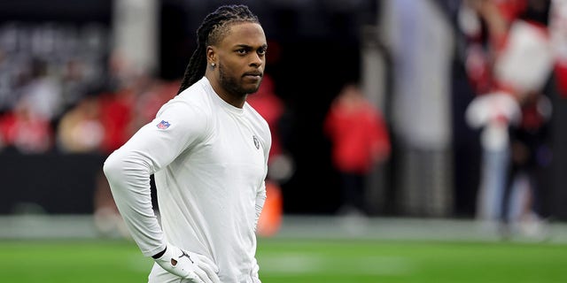 Wide receiver Davante Adams, #17 of the Las Vegas Raiders, stands on the field as he warms up before a game against the San Francisco 49ers at Allegiant Stadium on January 1, 2023, in Las Vegas, Nevada. The 49ers defeated the Raiders 37-34 in overtime. 