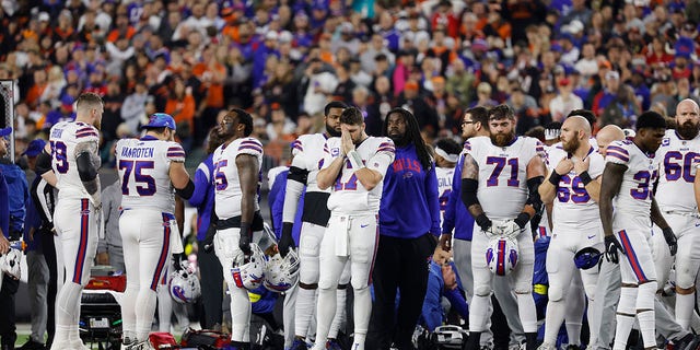 Buffalo Bills players react after teammate Damar Hamlin #3 was injured against the Cincinnati Bengals during the first quarter at Paycor Stadium on January 02, 2023 in Cincinnati, Ohio.