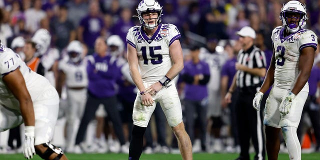 Quarterback Max Duggan, #15 of the TCU Horned Frogs, gestures during the second half of the Vrbo Fiesta Bowl against the Michigan Wolverines at State Farm Stadium on December 31, 2022, in Glendale, Arizona. 