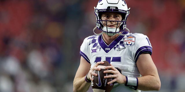 Quarterback Max Duggan, #15 of the TCU Horned Frogs, warms up before the Vrbo Fiesta Bowl against the Michigan Wolverines at State Farm Stadium on December 31, 2022, in Glendale, Arizona. 