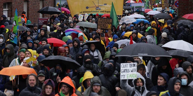 Protesters march to demonstrate against the razing of the settlement of Luetzerath on January 14, 2023 in Keyenberg, Germany. 