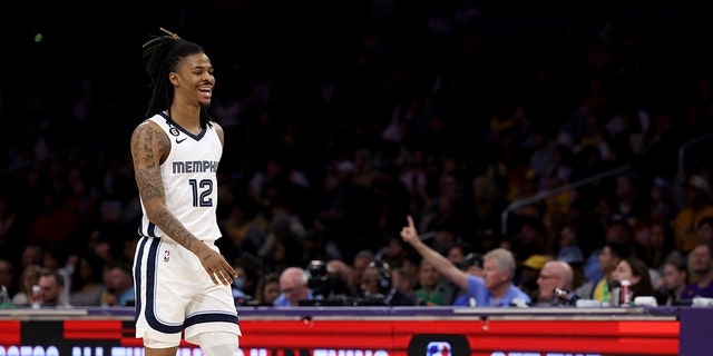 LOS ANGELES, CALIFORNIA - JANUARY 20: Ja Morant #12 of the Memphis Grizzlies reacts as he walks to the bench during the first half against the Los Angeles Lakers at Crypto.com Arena on January 20, 2023 in Los Angeles, California. 