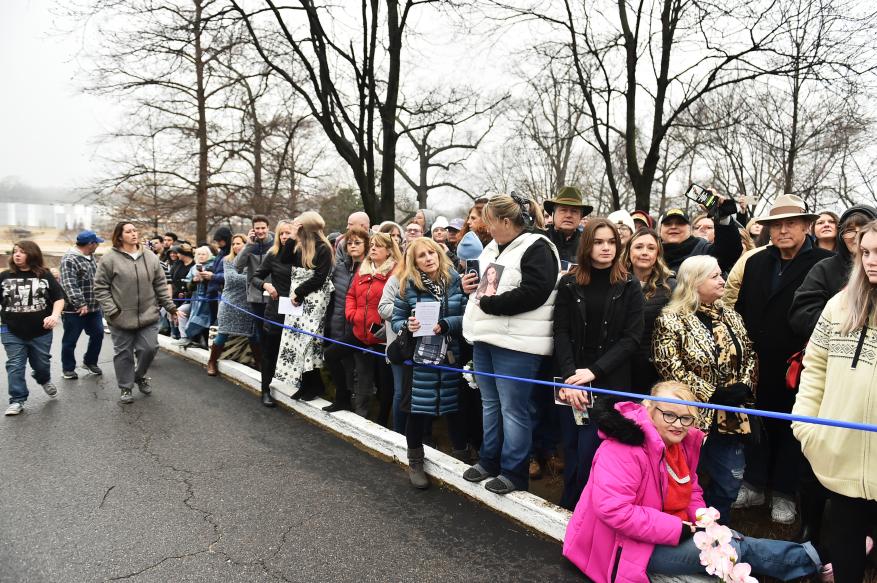 Hundreds of fans wait to enter Graceland Mansion, the estate of Elvis Presley, where a memorial service for Lisa Maria Presley took place on Jan. 22, 2023 in Memphis, Tenn.