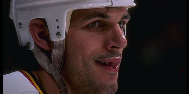 Leftwinger Gino Odjick of the Vancouver Canucks looks on during a game against the St. Louis Blues at General Motors Place in Vancouver, British Columbia. The game was a tie, 2-2.