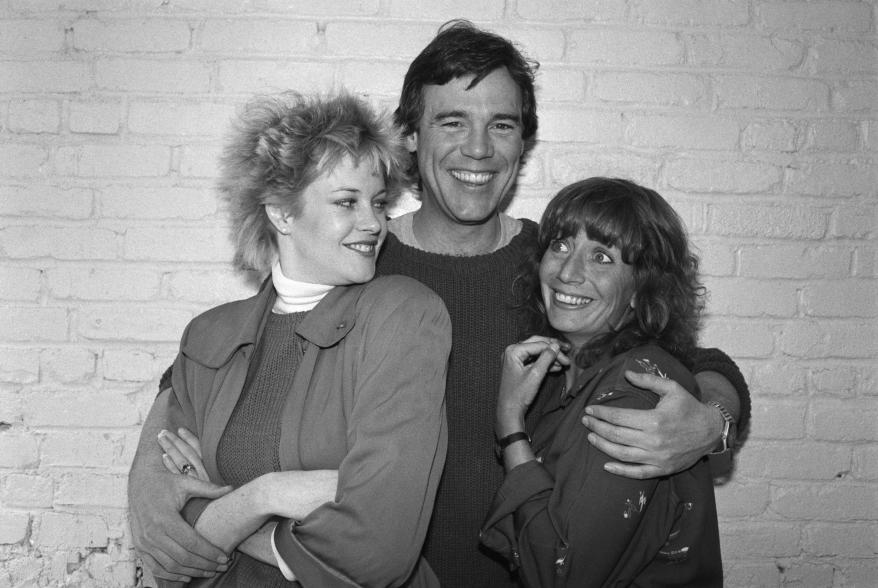 Actor Ben Masters hugs actresses Melanie Griffiths and Penny Marshall during a rehearsal at the Minetta Lane Theatre.