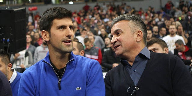 Serbian tennis player Novak Djokovic, left, attends the 2017/2018 Turkish Airlines EuroLeague Regular Season Round 7 game between Crvena Zvezda mts Belgrade and CSKA Moscow with his father Srdjan Djokovic at Kombank Arena on Nov. 15, 2017 in Belgrade, Serbia. 