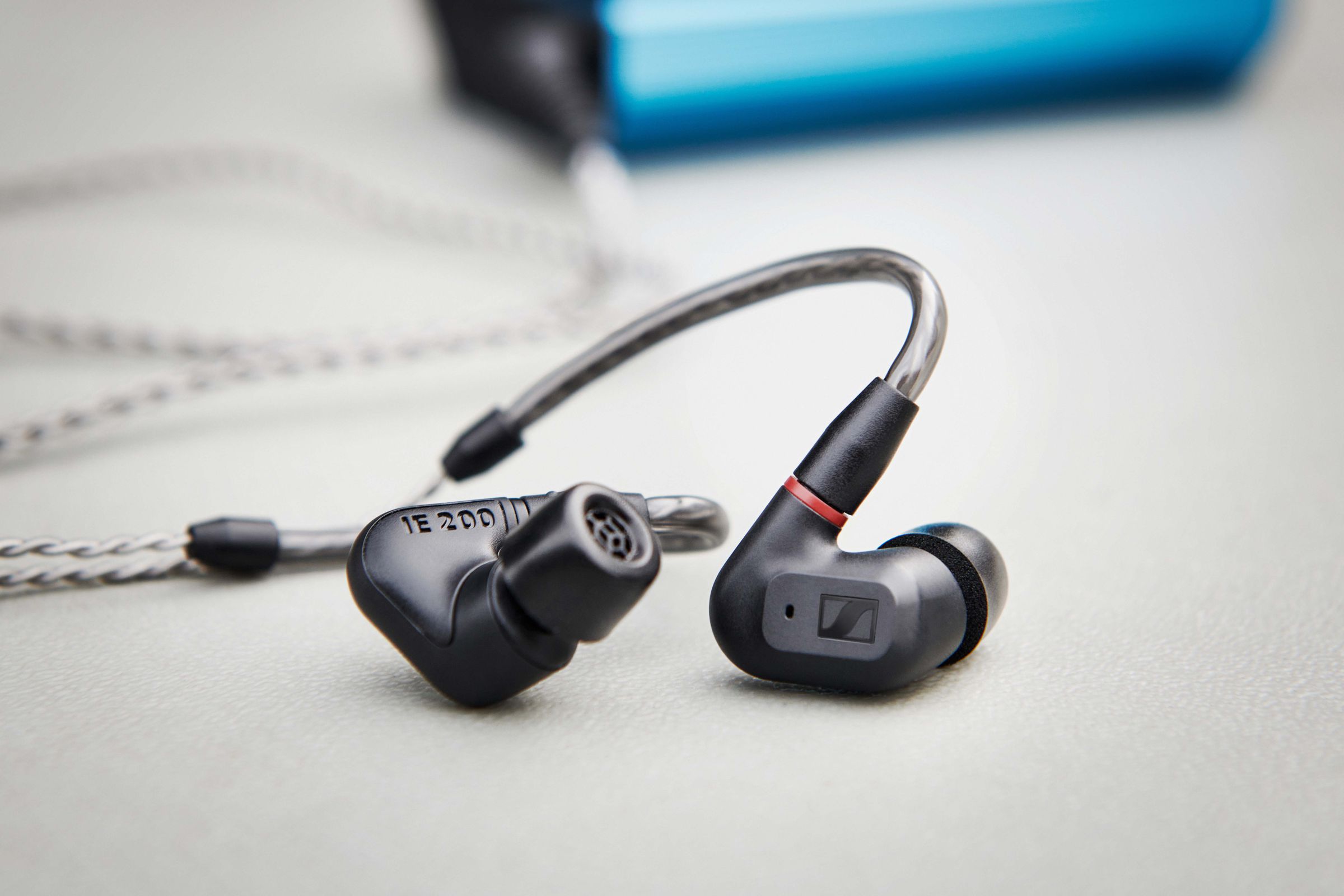 Sennheiser IE 200 headphones on a desk.