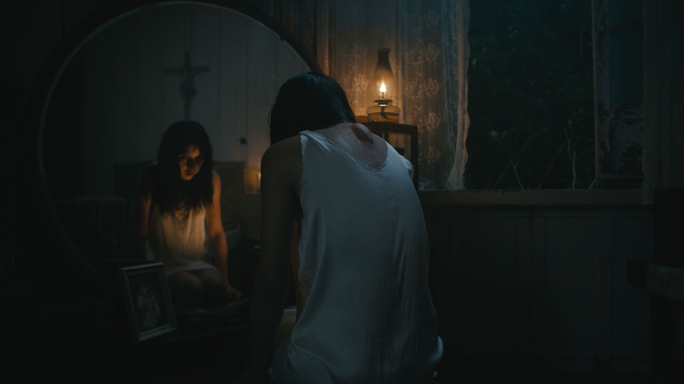 A still photo of Beauty Gonzalez in the horror film In My Mother’s Skin.