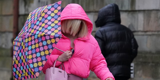 Isla Bryson, 31, formerly known as Adam Graham, from Clydebank, West Dunbartonshire, arrives at the High Court in Glasgow. 