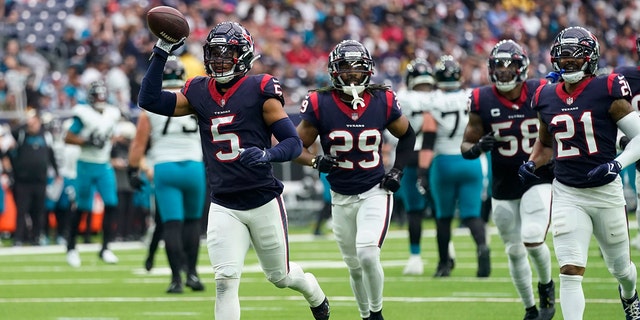 Texans safety Jalen Pitre celebrates his interception against the Jacksonville Jaguars in Houston, Sunday, Jan. 1, 2023.