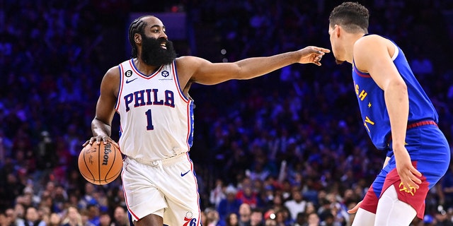 Sixers guard James Harden controls the ball against Denver Nuggets forward Michael Porter Jr. on Jan. 28, 2023, in Philadelphia.