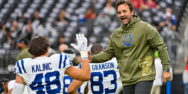 Indianapolis Colts interim head coach Jeff Saturday, right, greets tight end Nikola Kalinic before an NFL football game against the Las Vegas Raiders in Las Vegas, Sunday, Nov. 13, 2022. 