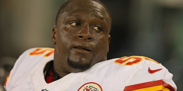 Jerrell Powe #95 of the Kansas City Chiefs rests on the sidelines during a preseason game against the Green Bay Packers at Lambeau Field on August 30, 2012 in Green Bay, Wisconsin.