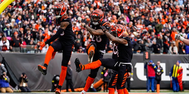 Cincinnati Bengals running back Joe Mixon, center, celebrates a touchdown against the Baltimore Ravens in the first half of a game in Cincinnati Sunday, Jan. 8, 2023. 