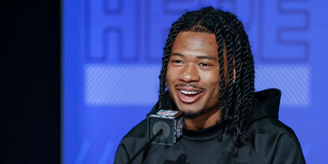 John Metchie #WO18 of the Alabama Crimson Tide speaks to reporters during the NFL Draft Combine at the Indiana Convention Center on March 2, 2022 in Indianapolis, Indiana.